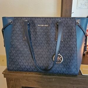 Michael Kors tote and wallet set.